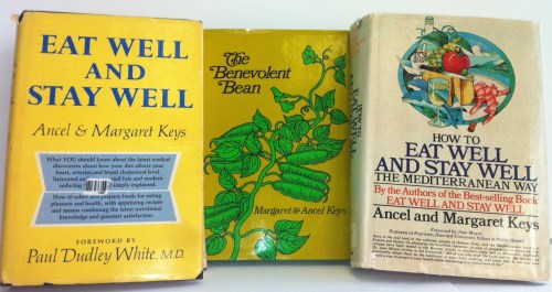 The covers of the three cookbooks written by Ancel and Margaret Keys. Photograph of the collage by JL Dixon. The cover images were used by permission of Penguin Random House LLC (which Doubleday & Company, Inc. is now part of) and Farrar, Straus and Giroux, LLC (which published The Benevolent Bean in 1972).